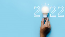 social media marketing in 2022, lighting bulb with new year number on blue background